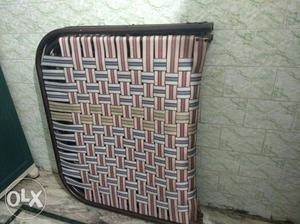 Red And Gray Weave Folding Bed