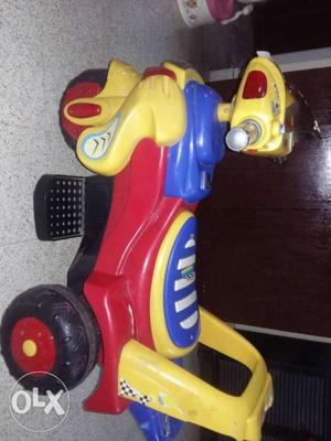 Red, Yellow, And Blue Plastic Toy Car