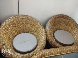 Two Brown Wicker Framed Chairs