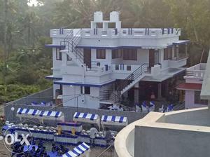 White And Blue Concrete 3-storey House