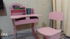 White And Pink Wooden Table With Chairs