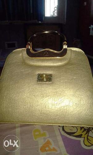 Branded fragrance purse, stylish, golden colour,
