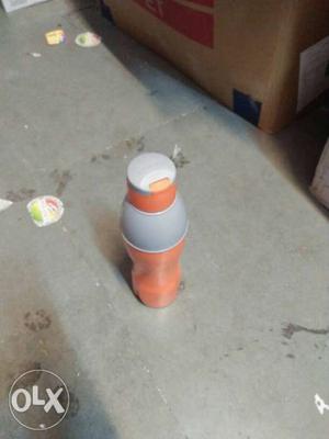 Orange And White Plastic Bottle