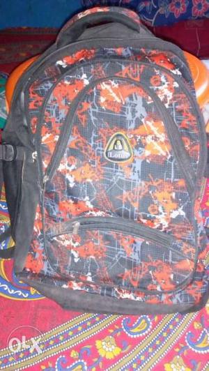 Orange, Black, And Grey Camouflage Backpack