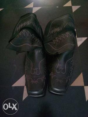 Pair Of Black Leather Cowboy Boots