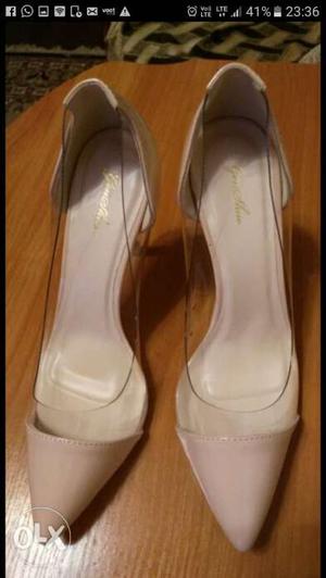 Pair Of Women's White Leather Pumps