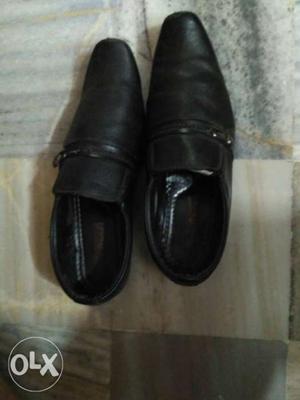 Size UK 10 black formal shoes in good condition