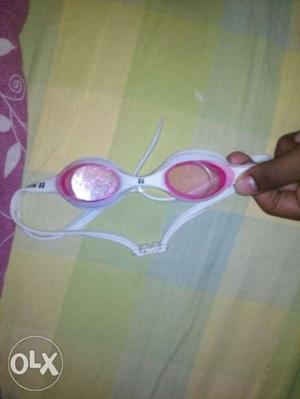 Swimming cap and goggle both with rupee 