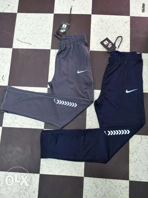 Two Black And Blue Nike Track Pants