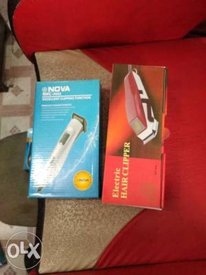 Two Gray And Red Hair Clipper Boxes