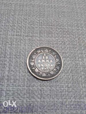  Black And Silver-colored 1 1/2 Indian Anna Coin