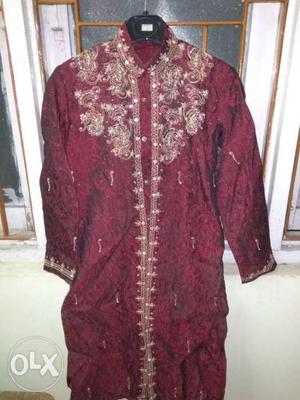 Maroon color sherwani with cream color chudhidaar, used only