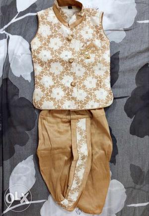 Party wear kurtha set with gold&cream combination for 1 year