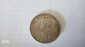 Round Silver-colored Emperor George Coin