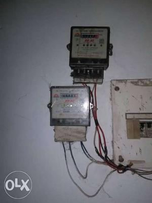 Two Gray Electric Meters running condition