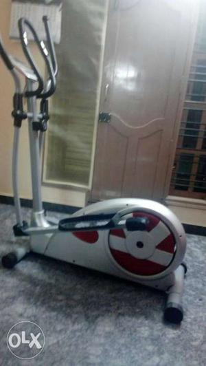 Black, Grey, And Red Elliptical Trainer