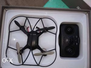 Black Quadcopter Drone With Controller And Box