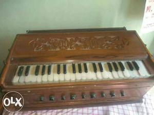 Brown Harmonium with cover. Product Information:-
