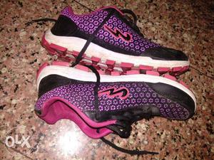 Pair Of Black-and-pink Champion Running Shoes