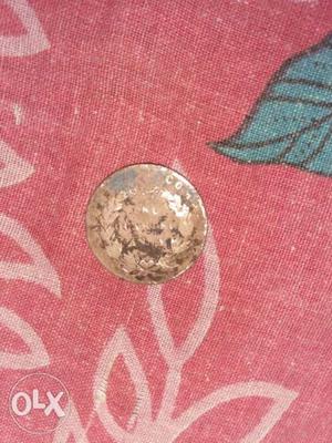Round Copper-colored Embossed Coin, masiha, one quarter