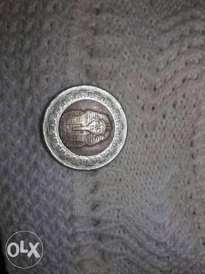Round Gray And Brown Coin