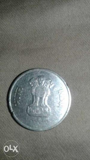 Round Silver-colored Indian Coin