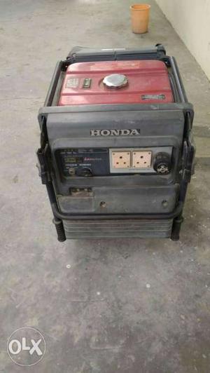 Grey And Red Honda Portable Power Generator