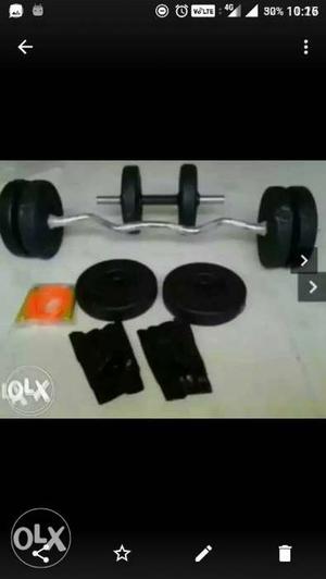 Black Dumbbell, Weight Plates, And EZ Curl Barbell