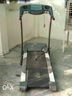 Body sculpture treadmill with power incline