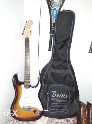 Brown Beats Stratocaster-style Electric Guitar With Black