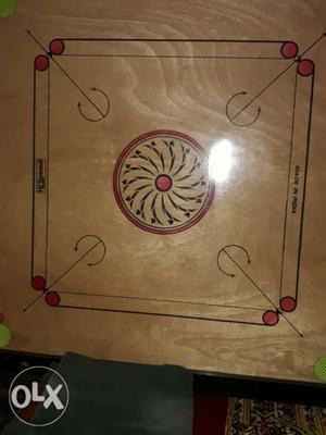 Brown, Black, And Red Carom Board