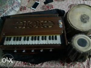 Brown Harmonium And Two Brown Table Drums