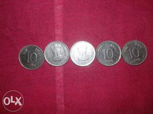 Four Silver-colored 10 Indian Paise Coins