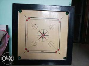 New carrom only 15 days used with stand,coins and striker