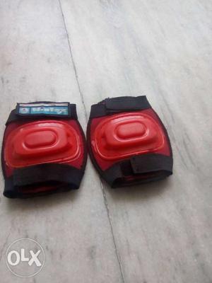 Pair Of Black-and-red Elbow Pads