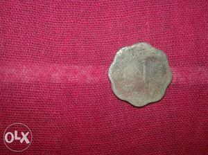 Scalloped Edge Round Silver-colored Coin