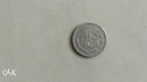 Silver-colored 25 Indian Coin