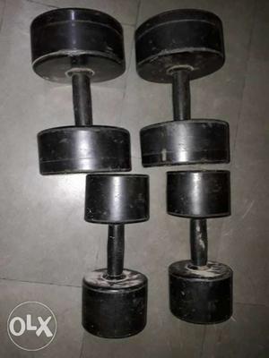 Two Pairs Of Gray Dumbbells