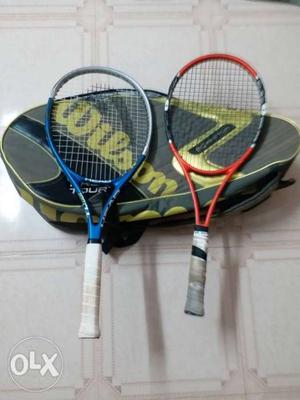 Two Red And Blue Tennis Rackets