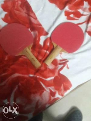 Two Red Table Tennis Rackets