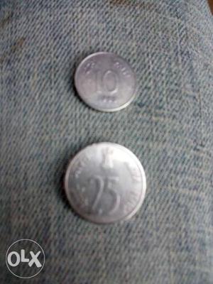 Two Round Silver-colored 10 And 25 Indian Coins