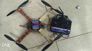 White, Brown, Blue, And Black Quadcopter Drone With Remote