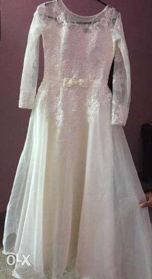 A Length Offwhite Pearl Beaded Wedding Gown
