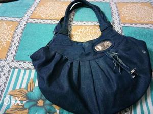 Blue colour purse with lot of space. less used