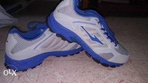 Pair Of Grey-and-blue ERKE Running Shoes