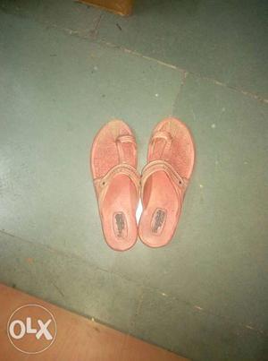 Pair Of Orange Flat Sandals