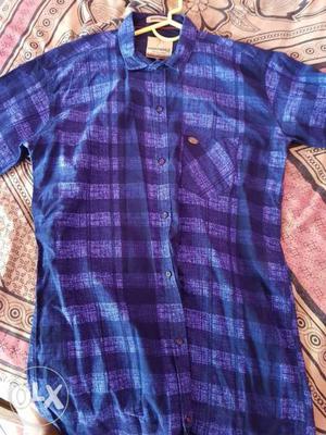 Plain and checks shirt at ₹300 and printed