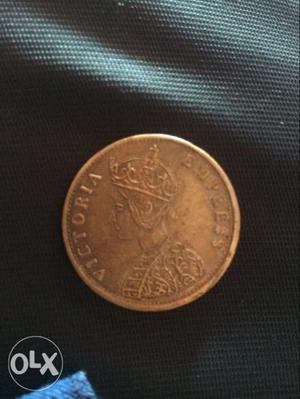 Round Gold-colored Victoria Coin