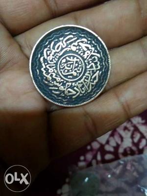 Round Silver And Blue Coin