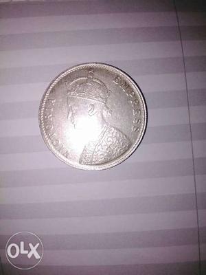 Silver old coin one rupee in India 